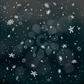Closeup snowfall on dark night black backdrop. Winter holiday Christmas background. Big and small snowflakes falling from clouds