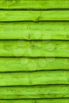 Green wooden boards vertical background. Wall floor or fence exterior design. Natural wood material backdrop