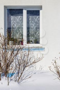 Snow covered house and window. Fresh snowdrift and home. Snowy covered landscape