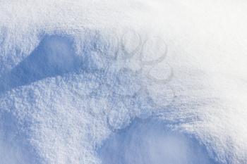 Winter snow cover hill view from above. Fresh snowdrift wallpaper. Snowy covered landscape. Snowflake and ice mound