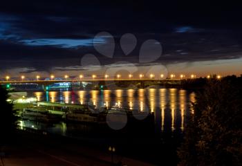 Night bridge over the Volga River, dotted with dozens of lanterns. Russia, Yaroslavl