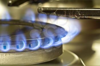 Flames of gas stove close-up shot. Natural gas