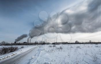 Power plant pollutes the environment, winter shot
