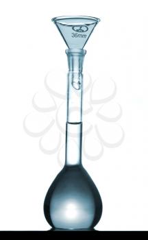 Isolated chemical volumetric flask and funnel on table with a small reflection, studio shot