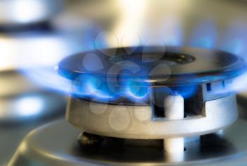 Gas stove with flames of burning gas, studio shot