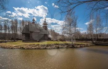 Ancient wooden temple stands on the banks of the river. Kostroma, Russia