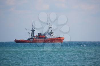 Russian fishing boat floats in the open sea, outdoors shot, 