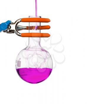 Chemical round bottom flask on a stand with solution, studio shot, isolated on white background