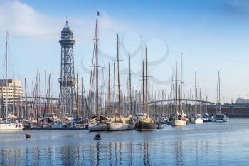 Port of Barcelona, Spain. Yachts, boats and old big tower