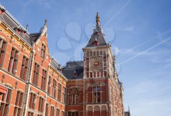 Old building facade of Amsterdam Centraal - central railroad station of the City