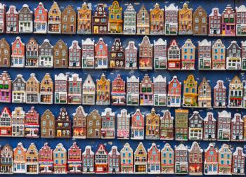 Traditional colorful houses magnets hanging on souvenir shop counter in Amsterdam