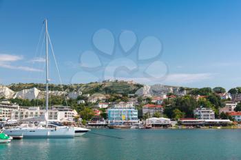 Yachts and pleasure boats are moored in marina of Balchik town, Bulgaria