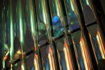 Row of bright shining colorful organ tubes