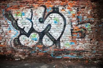 Saint-Petersburg, Russia - April 3, 2015: Urban brick wall with grungy chaotic graffiti letters. Vasilievsky island, Central old part of St. Petersburg city
