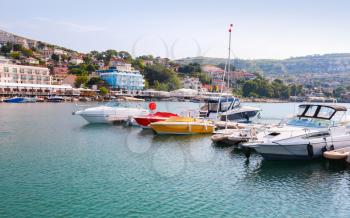 Yachts and pleasure motor boats are moored in marina of Balchik, Bulgaria
