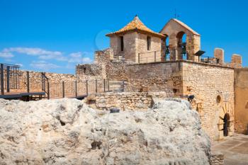 Small medieval stone castle on the rock in ancient Calafell town, Spain