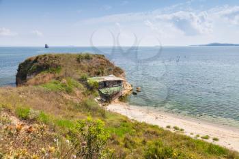 Wild beach with small abandoned coastal restaurant building, Black sea coast, Burgas, Bulgaria