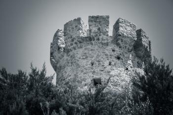 Campanella tower, old Genoese tower on Corsica island, France. Monochrome toned photo