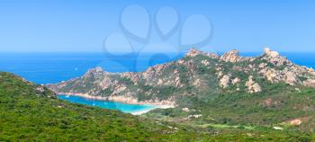 Corsica island, coastal panoramic landscape with mountains and beach. Mediterranean Sea coast, France