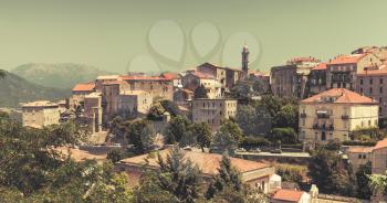 Old town cityscape. Sartene, Corsica, France. Vintage toned photo with old style filter effect