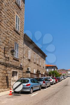 Street view with parked cars. Sartene, Corsica, France