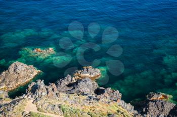 Coastal rocks in Mediterranean Sea water, Corsica island, Ajaccio region