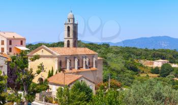 Small Corsican village landscape, living houses and church. Petreto-Bicchisano, Corsica, France