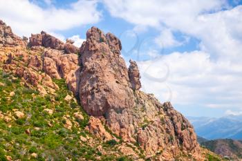 Rocky mountains and cloudy sky on a background. South of Corsica island, France, Natural landscape
