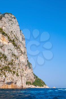 Vertical coastal landscape with rocks of Capri island, Mediterranean Sea, Italy