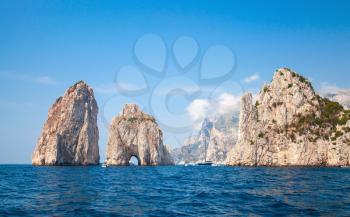Faraglioni rocks, Capri island, Italy. Mediterranean Sea summer coastal landscape