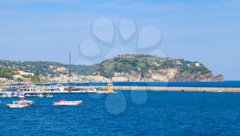 Landscape of Casamicciola Terme port with Lacco Ameno bay on a background, Ischia Island, Italy