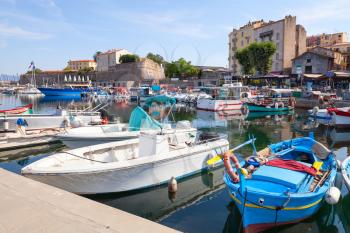 Small wooden fishing boats moored in Ajaccio port, Corsica, France