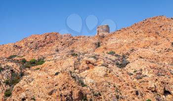 Ancient Genoese tower on the top of Capo Rosso. Piana region, Corsica island, France