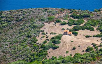Rural landscape, small abandoned stone house in coastal mountains. Piana, South Corsica, France, bird eye view