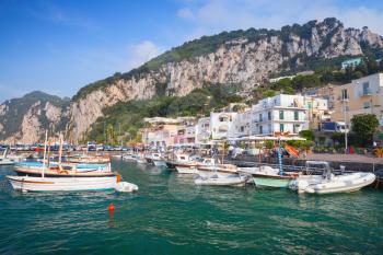 Port of Capri, Italy. Colorful houses and moored boats