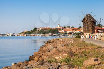 Coastal landscape with old windmill. Ancient town Nessebar, Bulgaria. Black Sea coast in sunny day