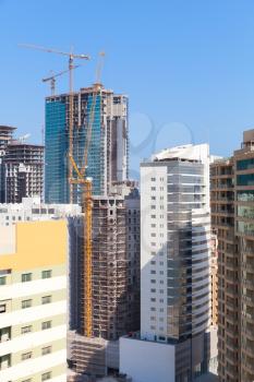 Modern office buildings and hotels are under construction in the city of Manama, Bahrain