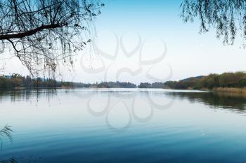 Silent coastal landscape. West Lake park in Hangzhou city center, China