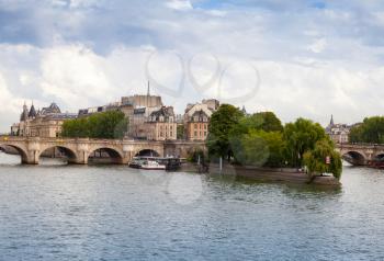 Cite Island and Pont Neuf, the oldest stone bridge across the Seine river in Paris, France