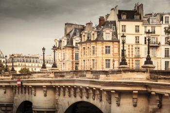Pont Neuf vintage stylized photo with filter effect. The oldest bridge across the Seine river in Paris, France