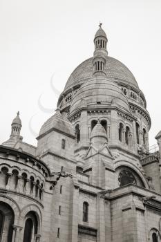 Sacre Coeur Basilica, large medieval cathedral, Basilica of Sacred Heart, one of the most popular landmark of Paris, France. Sepia toned photo
