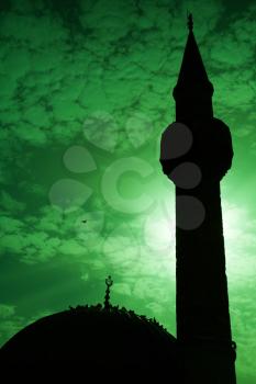 Minaret of ancient Camii mosque, Konak square, Izmir, Turkey. Green toned photo