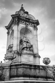 Fountain Saint-Sulpice in Paris, France. Black and white vintage stylized photo