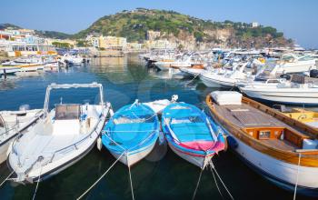 Pleasure boats and yachts moored in Lacco Ameno marina, Ischia island, Italy