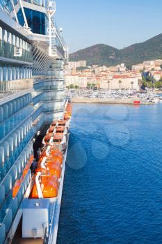 Passenger cruise ship enters the port of Ajaccio, Corsica island, France. View from a captain bridge wing