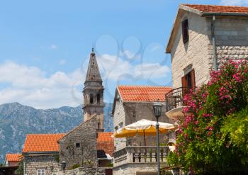 Bell tower of St. Nicholas Church in Perast town. Bay of Kotor