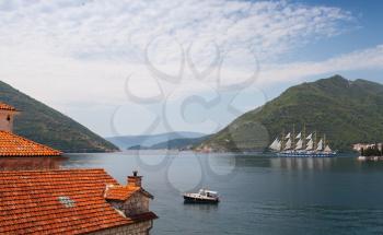 Bay of Kotor, red roofs of Perast town and big sailing ship