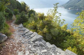Narrow mountain trail on the coastal rocks, Bay of Kotor