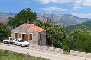Rural landscape of South Corsica, old stone house near mountain road. Zerubia village, France
