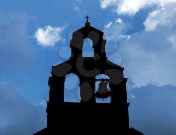 Silhouette of Serbian Orthodox Church with bell in Petrovac, Montenegro